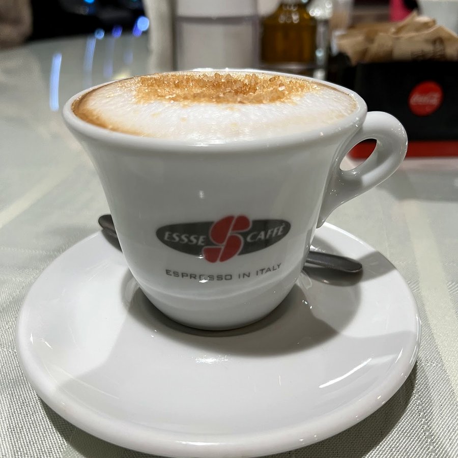 Cappuccino served in a branded Rasmus cup